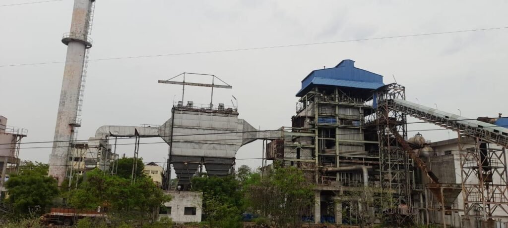 An industrial cogeneration plant with complex piping systems. The image features extensive piping infrastructure designed by a skilled piping engineer, showcasing intricate pipe layouts, boilers, epc, chimney.